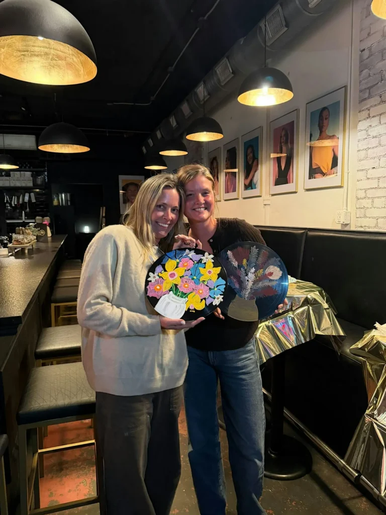 Guests painting recycled vinyl records during an art workshop at The Broken Leash.