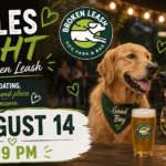Singles enjoying drinks and conversation with their dogs at Singles Night at The Broken Leash.